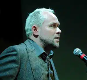 Man Speaking into microphone
