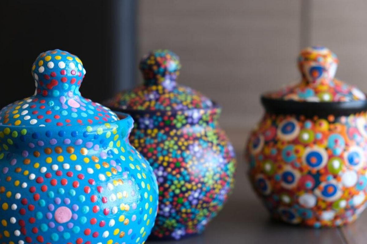 Pet cremation urn surrounded by flowers and gentle light.